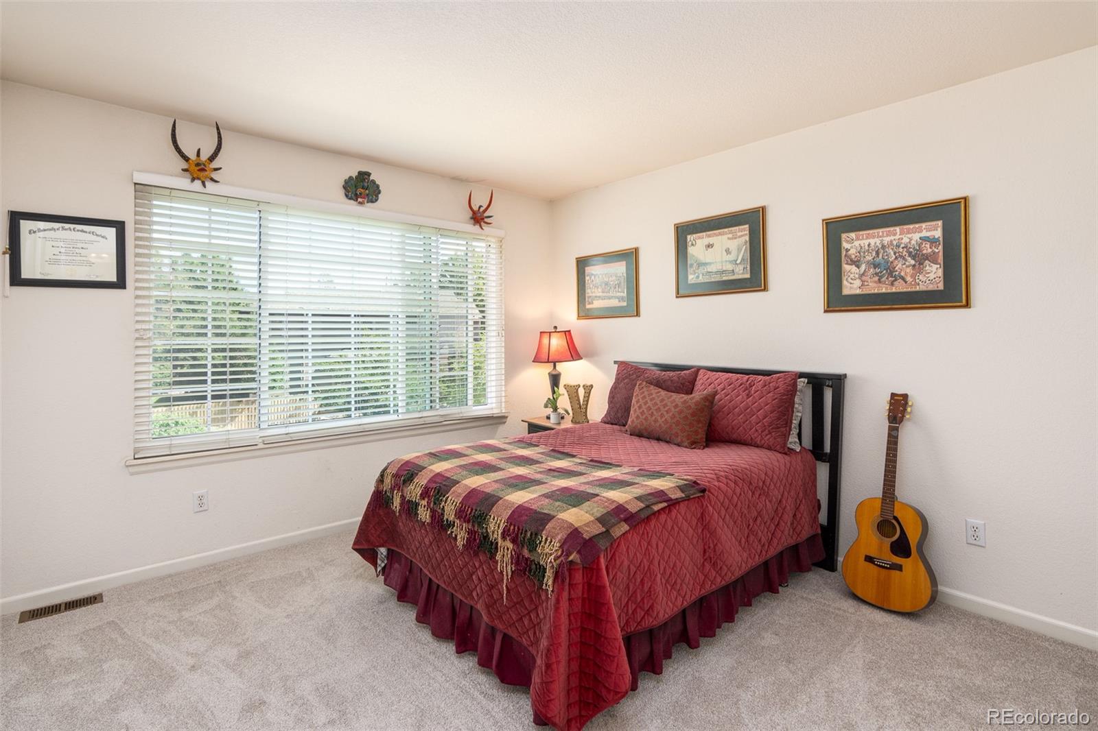 1082 Eldorado Drive Superior, CO 80027 - Photo 23 of 40 a bedroom with a bed and a window