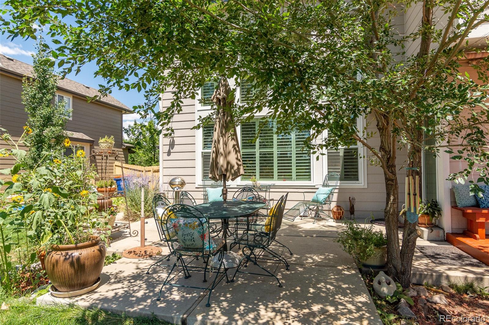 1082 Eldorado Drive Superior, CO 80027 - Photo 38 of 40 a view of a patio with table and chairs and potted plants