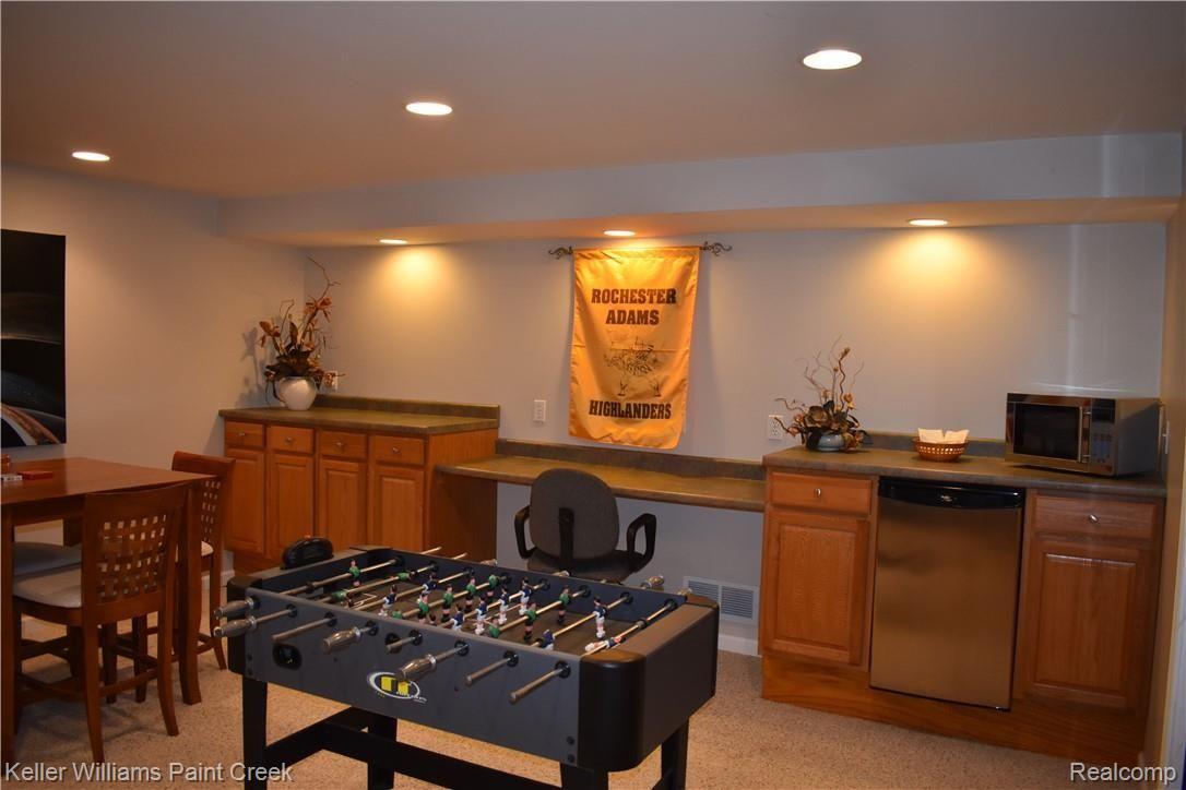 1993 Ridgefield Court Rochester, MI 48306 - Photo 41 of 47 CHECK OUT THE BAR REFRIGERATOR, MICROWAVE, NUMEROUS CABINETS & ALL OF THE COUNTERTOPS IN THE LARGE FINISHED BASEMENT (855 SQ FT).