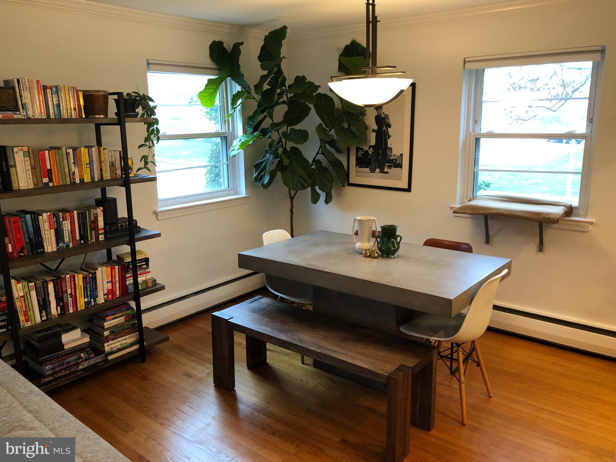 61 Llanfair Road, Unit A1 Ardmore, PA 19003 - Photo 5 of 9 a view of a workspace with furniture and a window