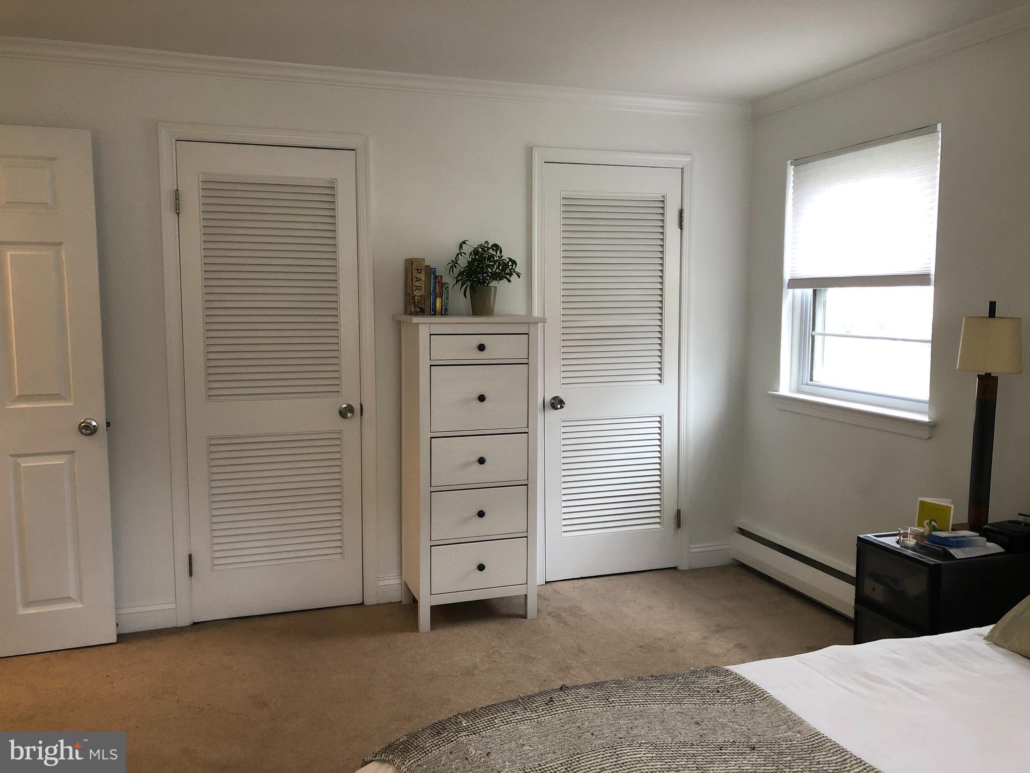 61 Llanfair Road, Unit A1 Ardmore, PA 19003 - Photo 8 of 9 a view of room with cabinet and closet
