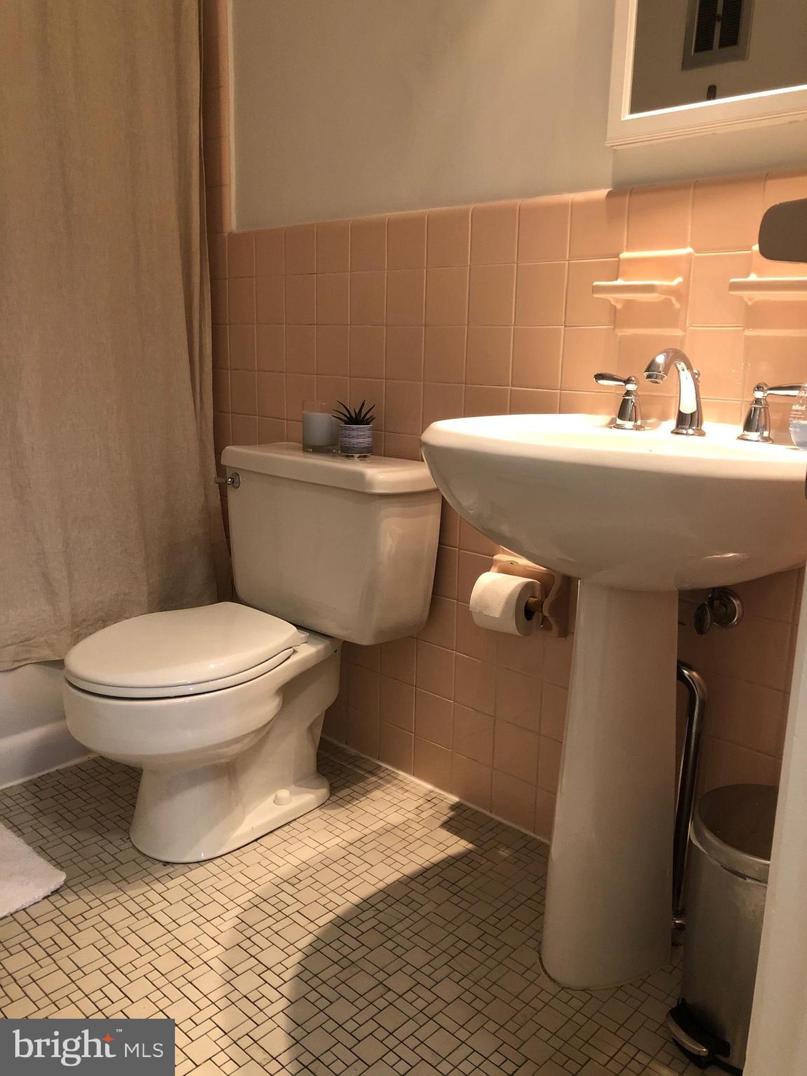 61 Llanfair Road, Unit A1 Ardmore, PA 19003 - Photo 9 of 9 a bathroom with a sink toilet and