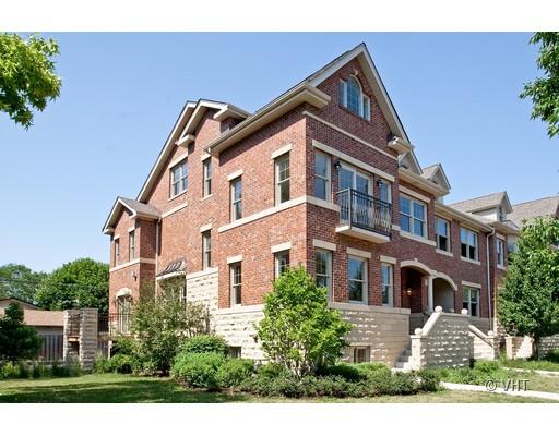 21 North Herbert Road, Unit J Riverside, IL 60546 - Photo 1 of 15 a front view of a residential apartment building with a yard