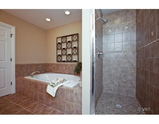 21 North Herbert Road, Unit J Riverside, IL 60546 - Photo 11 of 15 a bathroom with a tub shower and a sink