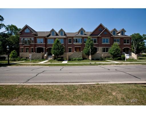 21 North Herbert Road, Unit J Riverside, IL 60546 - Photo 15 of 15 a front view of a house with a yard and potted plants