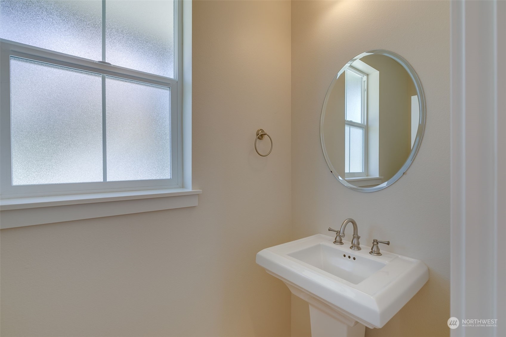 571 Lyons Place Northeast Renton, WA 98059 - Photo 25 of 27 a bathroom with a sink and a mirror