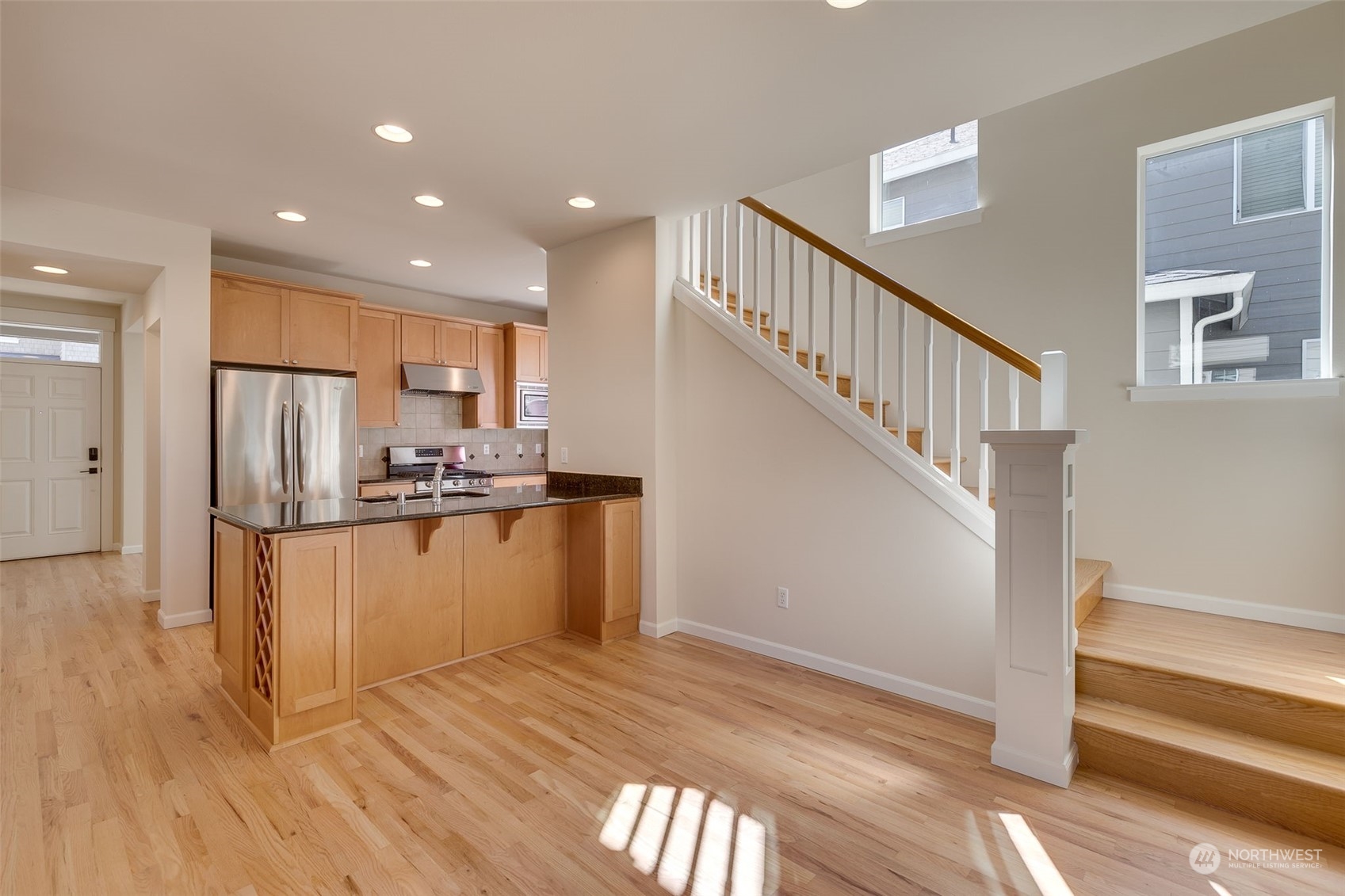 571 Lyons Place Northeast Renton, WA 98059 - Photo 7 of 27 a view of kitchen with stainless steel appliances refrigerator microwave and stove