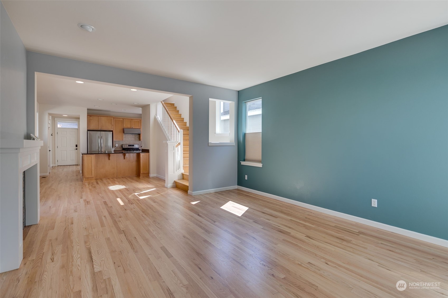 571 Lyons Place Northeast Renton, WA 98059 - Photo 10 of 27 wooden floor in an empty room with a window