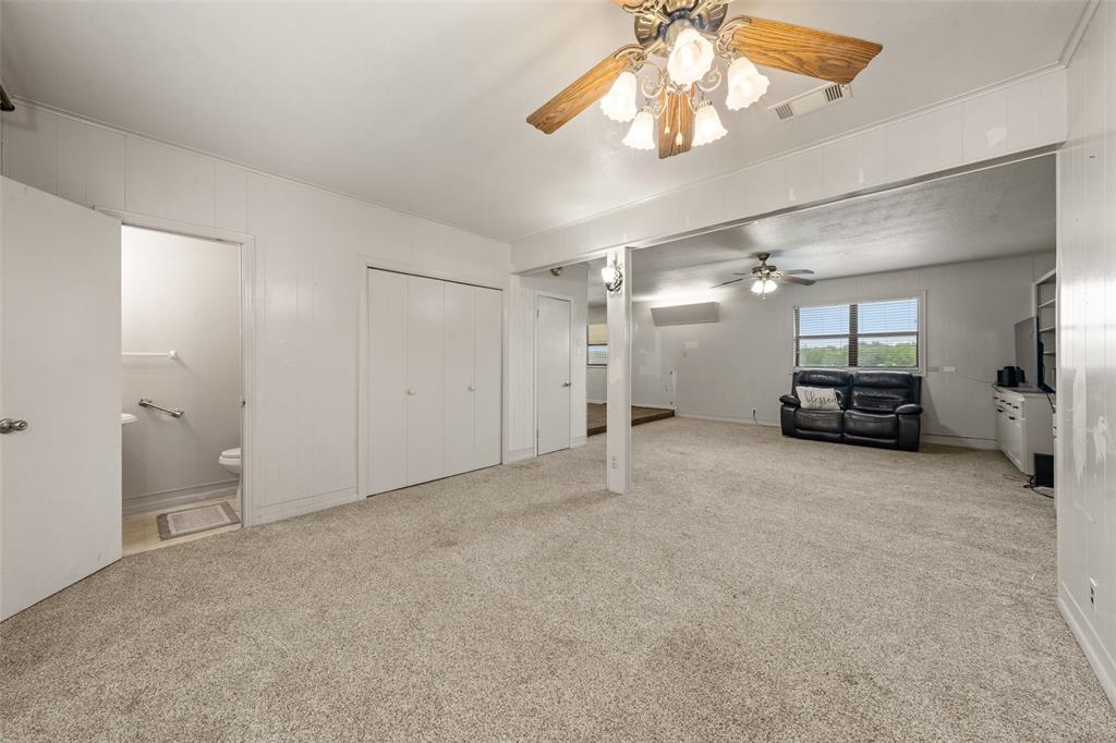 608 West Spring Street West, TX 76691 - Photo 4 of 27 a living room with furniture and a chandelier