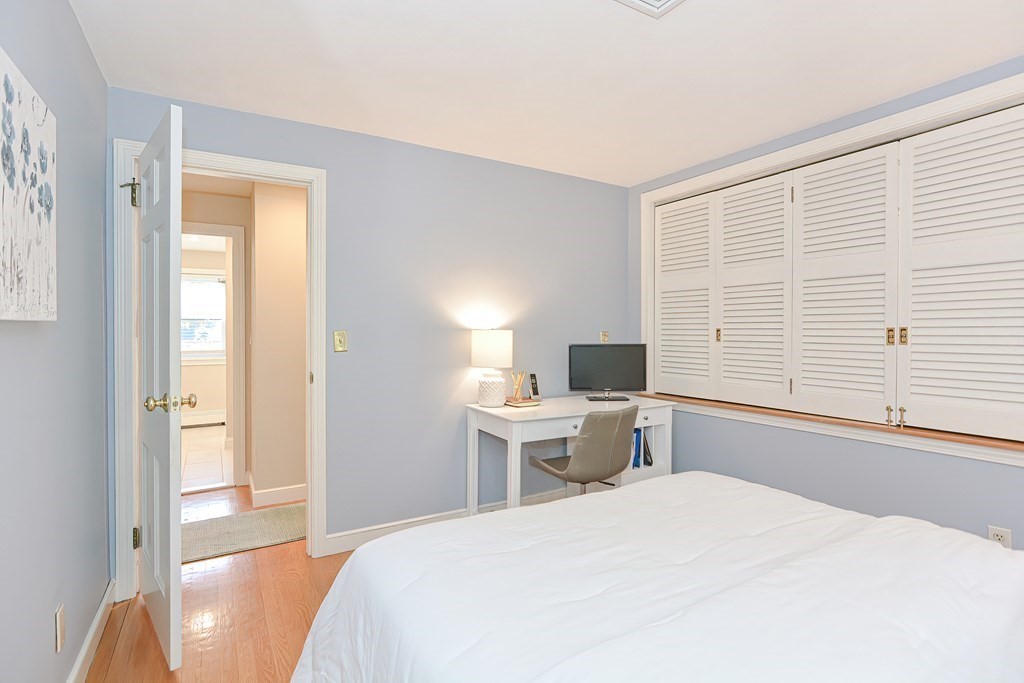 7 Tamarack Road Medfield, MA 02052 - Photo 19 of 33 a bedroom with a bed and a large window