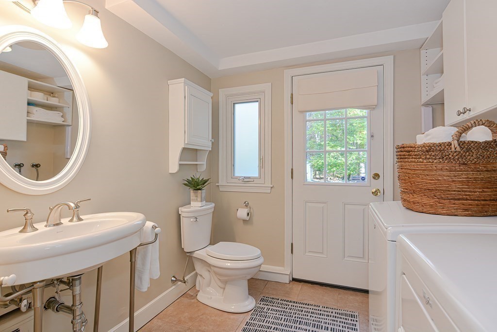7 Tamarack Road Medfield, MA 02052 - Photo 23 of 33 a bathroom with a sink a toilet and a window