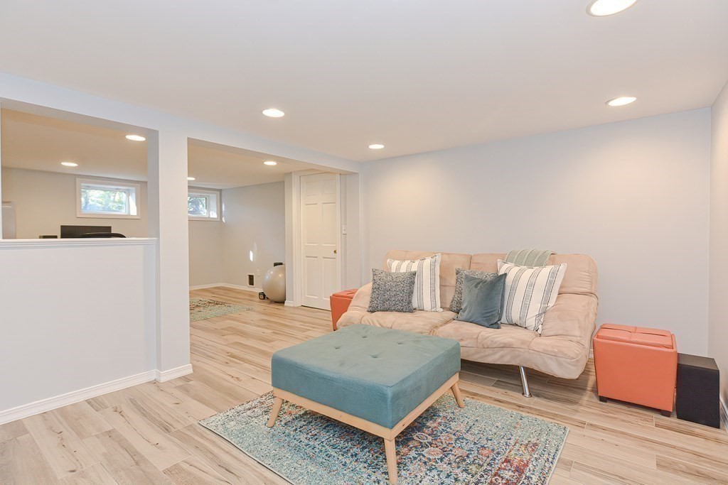 7 Tamarack Road Medfield, MA 02052 - Photo 25 of 33 a living room with furniture and a wooden floor
