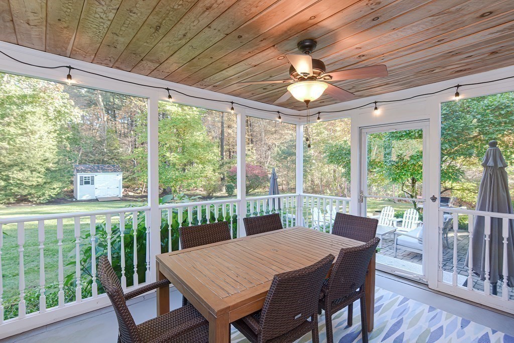 7 Tamarack Road Medfield, MA 02052 - Photo 27 of 33 a view of a dining room with furniture large windows and wooden floor