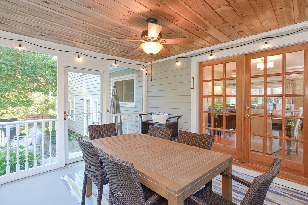 7 Tamarack Road Medfield, MA 02052 - Photo 28 of 33 a dining room with a table chairs and wooden floor