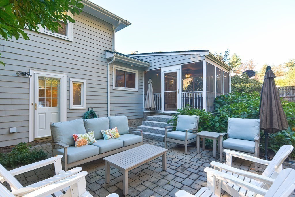 7 Tamarack Road Medfield, MA 02052 - Photo 29 of 33 a view of a patio with couches chairs and potted plants