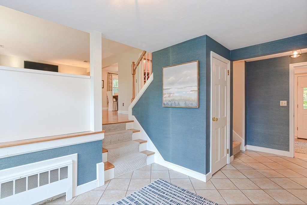 7 Tamarack Road Medfield, MA 02052 - Photo 3 of 33 a view interior of a house with wooden floor and windows