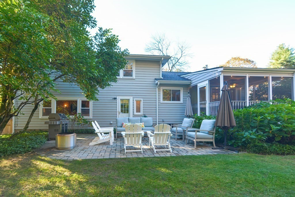 7 Tamarack Road Medfield, MA 02052 - Photo 31 of 33 a view of a chair and table in backyard of the house