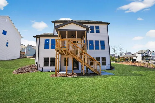 a view of a house with a yard porch and sitting area