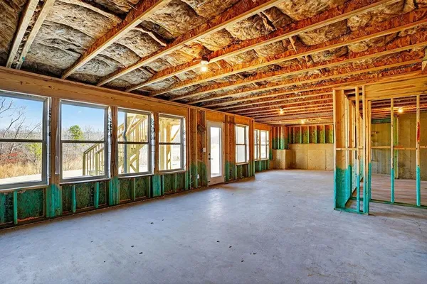 a view of an empty room with a balcony