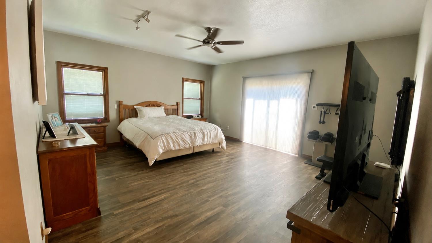 5012 Ustick Road Modesto, CA 95358 - Photo 21 of 26 a living room with a bed furniture and a window