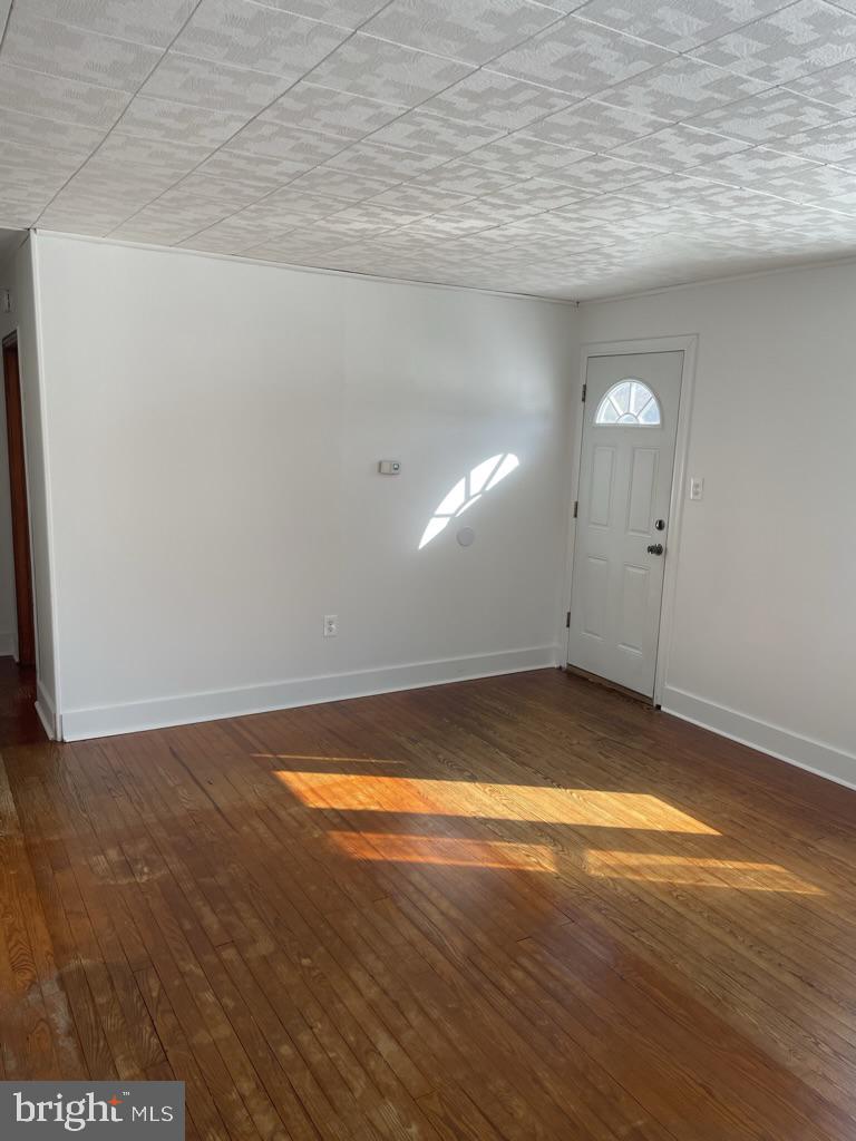 3530 Houston Branch Road Federalsburg, MD 21632 - Photo 3 of 20 a view of empty room with wooden floor