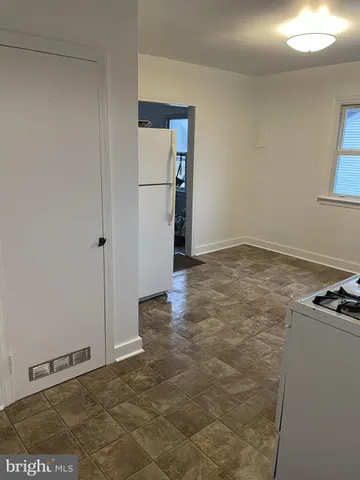 a view of a livingroom with furniture and window