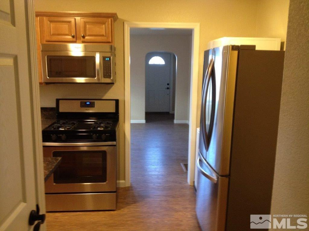 462 Laurel Street Reno, NV 89512 - Photo 11 of 16 a kitchen with a refrigerator and a stove
