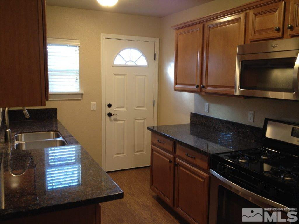 462 Laurel Street Reno, NV 89512 - Photo 13 of 16 a kitchen with a stove and a microwave