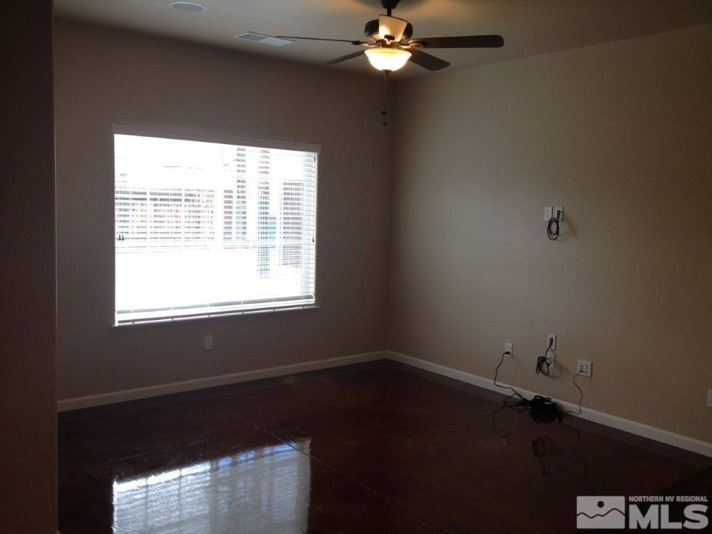 462 Laurel Street Reno, NV 89512 - Photo 3 of 16 a view of a workspace with furniture and a window