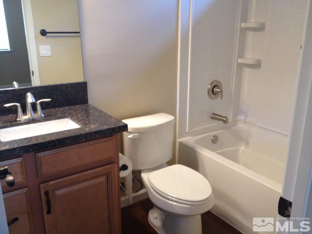 462 Laurel Street Reno, NV 89512 - Photo 7 of 16 a bathroom with a sink a toilet and shower