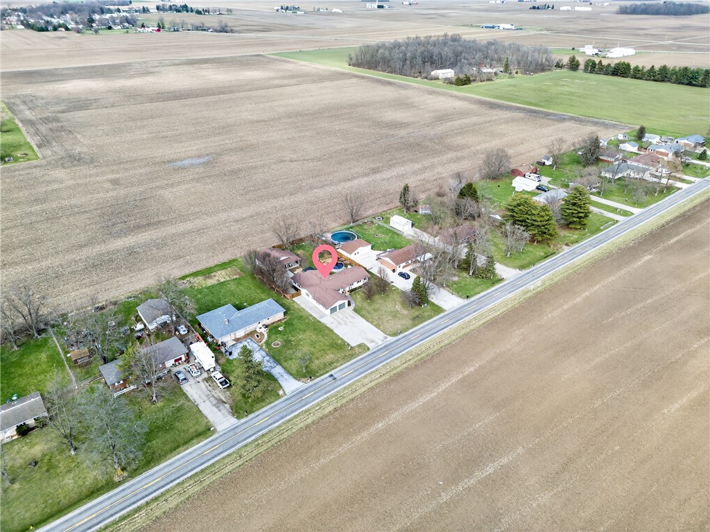 7888 Darke-Preble County Line Road Arcanum, OH 45304 - Photo 46 of 51 This property features a private pool and a two-car garage, nestled in a serene rural setting.
