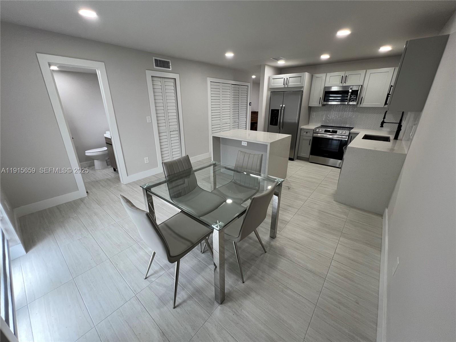 3826 Southwest 107th Avenue, Unit 22 Miami, FL 33165 - Photo 4 of 18 a view of a dining room with furniture and wooden floor