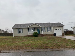 203 Ruf Drive Oak Grove, KY 42262 - Photo 1 of 10 a front view of a house with a yard