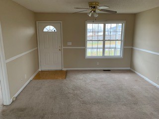 203 Ruf Drive Oak Grove, KY 42262 - Photo 2 of 10 an empty room with a window and a fan