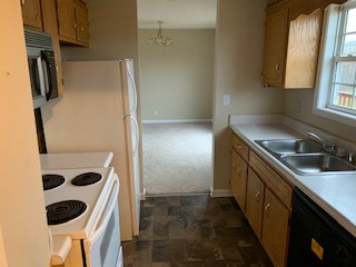 203 Ruf Drive Oak Grove, KY 42262 - Photo 4 of 10 a kitchen with a refrigerator and a sink