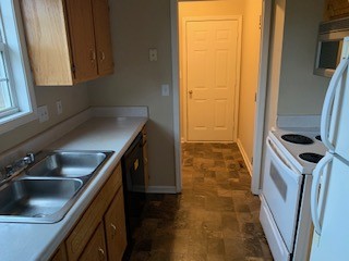 203 Ruf Drive Oak Grove, KY 42262 - Photo 5 of 10 a kitchen with a sink a refrigerator and washer