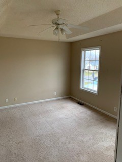 203 Ruf Drive Oak Grove, KY 42262 - Photo 8 of 10 an empty room with a window and a ceiling fan