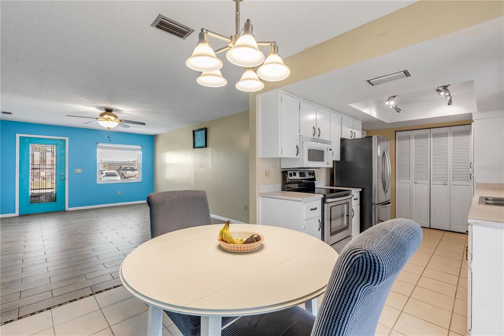 26 Laughing Gull Lane Edgewater, FL 32141 - Photo 14 of 66 a view of kitchen with cabinets and wooden floor