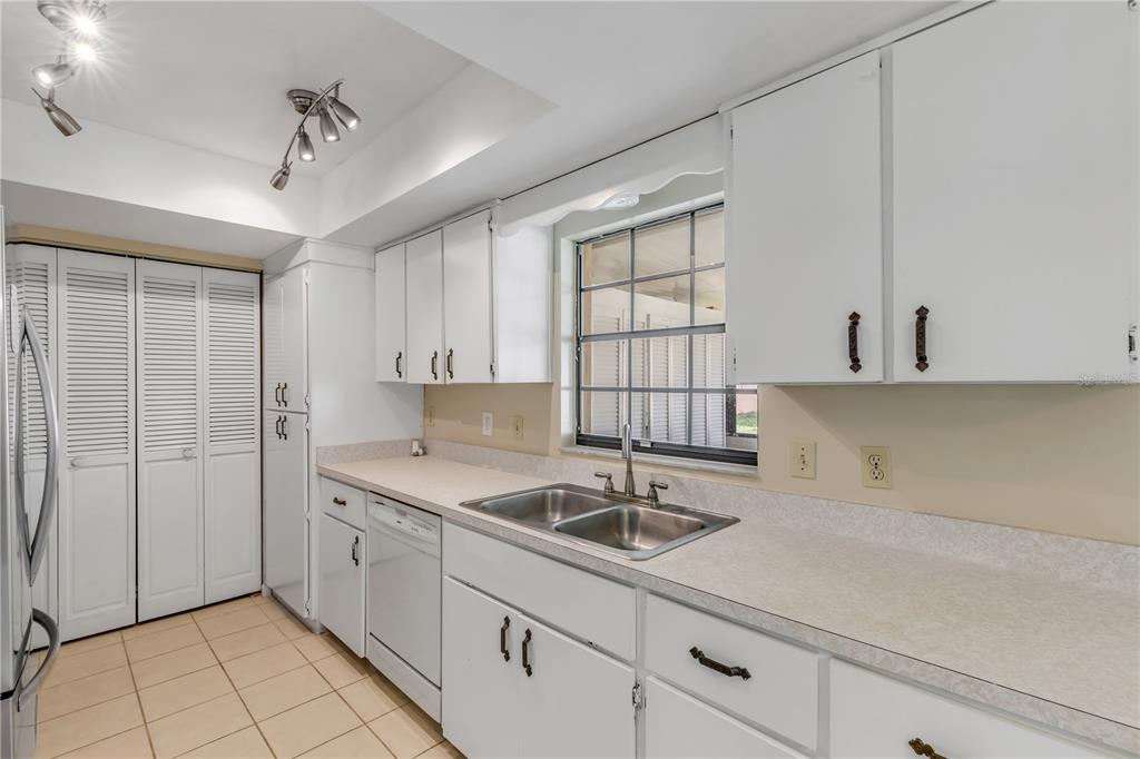 26 Laughing Gull Lane Edgewater, FL 32141 - Photo 17 of 66 a kitchen with a sink and cabinets