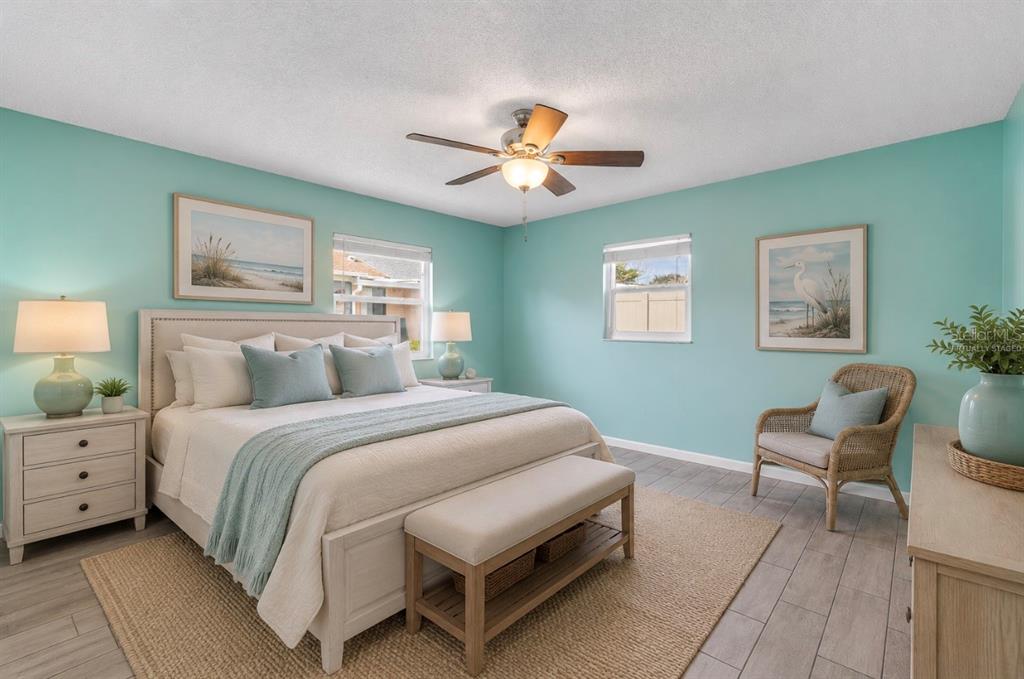 26 Laughing Gull Lane Edgewater, FL 32141 - Photo 23 of 66 a bedroom with a bed and a chair