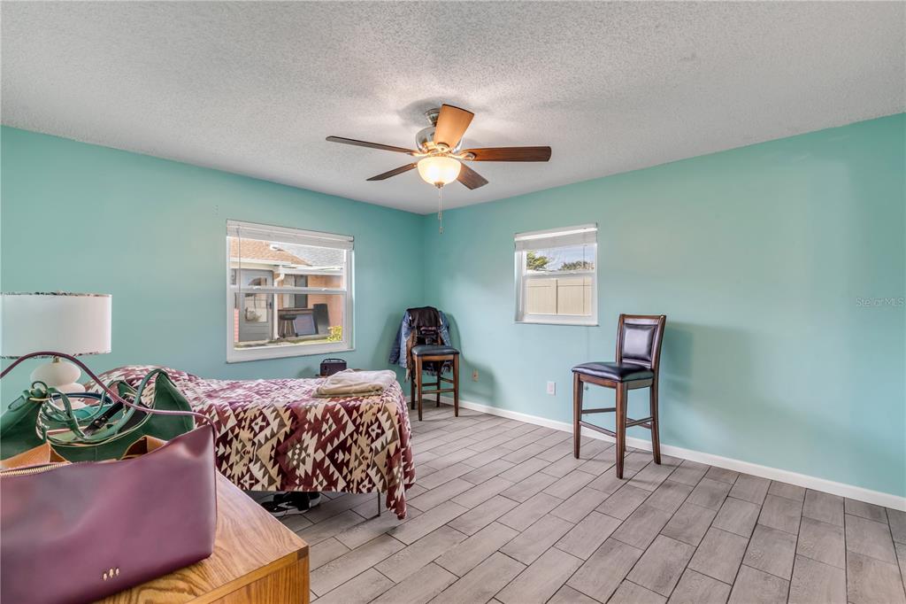 26 Laughing Gull Lane Edgewater, FL 32141 - Photo 24 of 66 a bedroom with furniture and a window