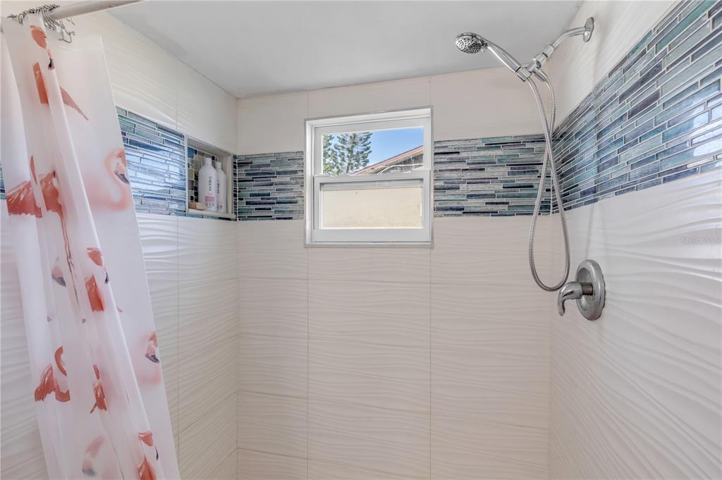 26 Laughing Gull Lane Edgewater, FL 32141 - Photo 26 of 66 a bathroom with a shower