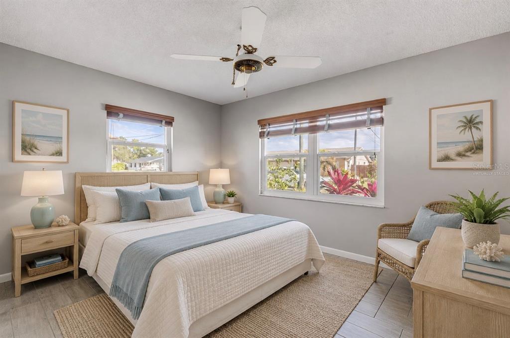 26 Laughing Gull Lane Edgewater, FL 32141 - Photo 27 of 66 a bedroom with a bed and a chandelier
