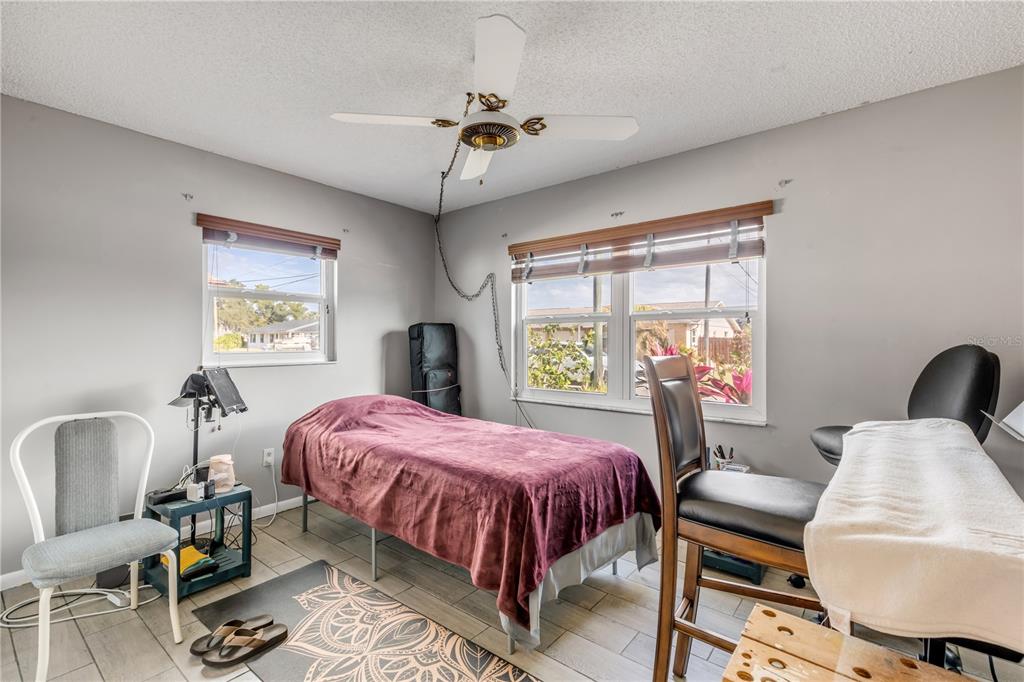 26 Laughing Gull Lane Edgewater, FL 32141 - Photo 28 of 66 a bedroom with a bed and wooden floor