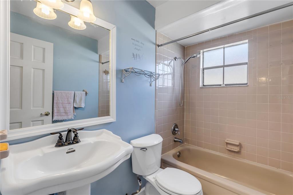 26 Laughing Gull Lane Edgewater, FL 32141 - Photo 29 of 66 a bathroom with a sink toilet and shower