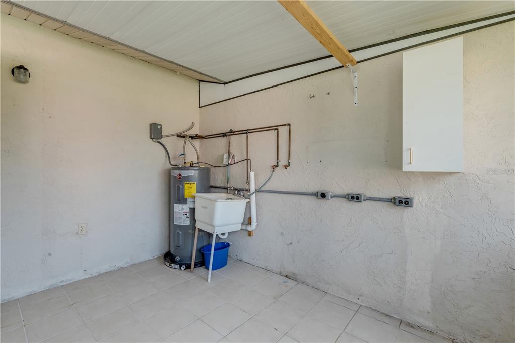 26 Laughing Gull Lane Edgewater, FL 32141 - Photo 34 of 66 a view of storage and utility room with racks on the wall