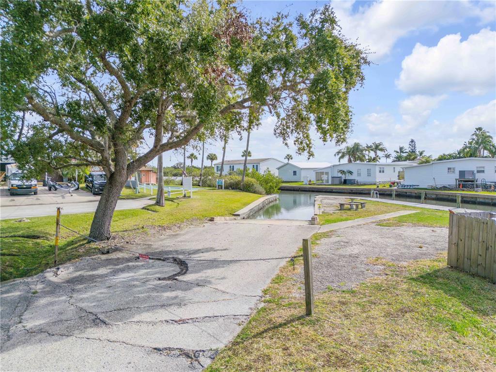 26 Laughing Gull Lane Edgewater, FL 32141 - Photo 50 of 66 a view of a swimming pool and a yard