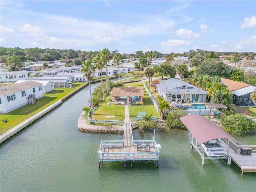 26 Laughing Gull Lane Edgewater, FL 32141 - Photo 61 of 66 a view of a city with lawn chairs