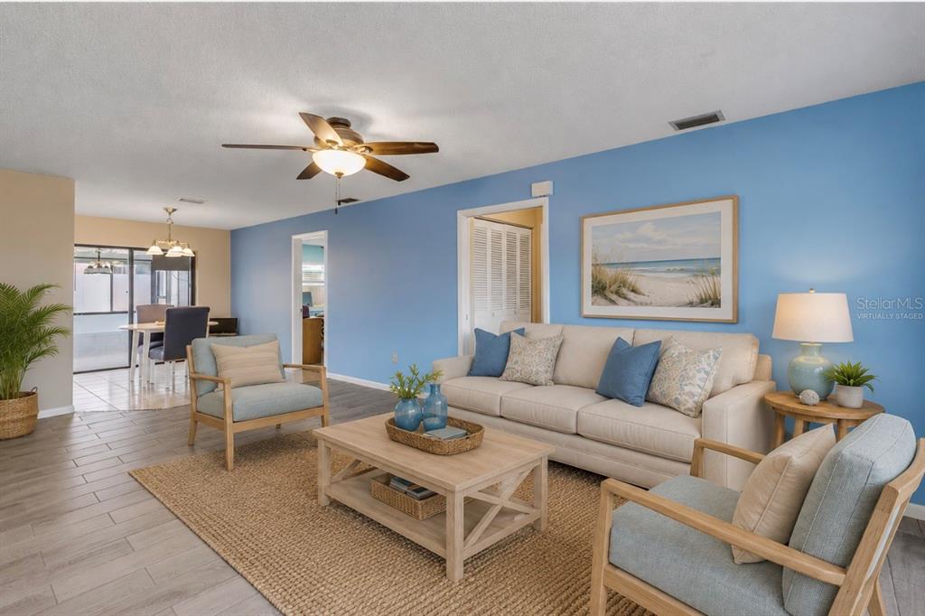 26 Laughing Gull Lane Edgewater, FL 32141 - Photo 9 of 66 a living room with furniture and a lamp