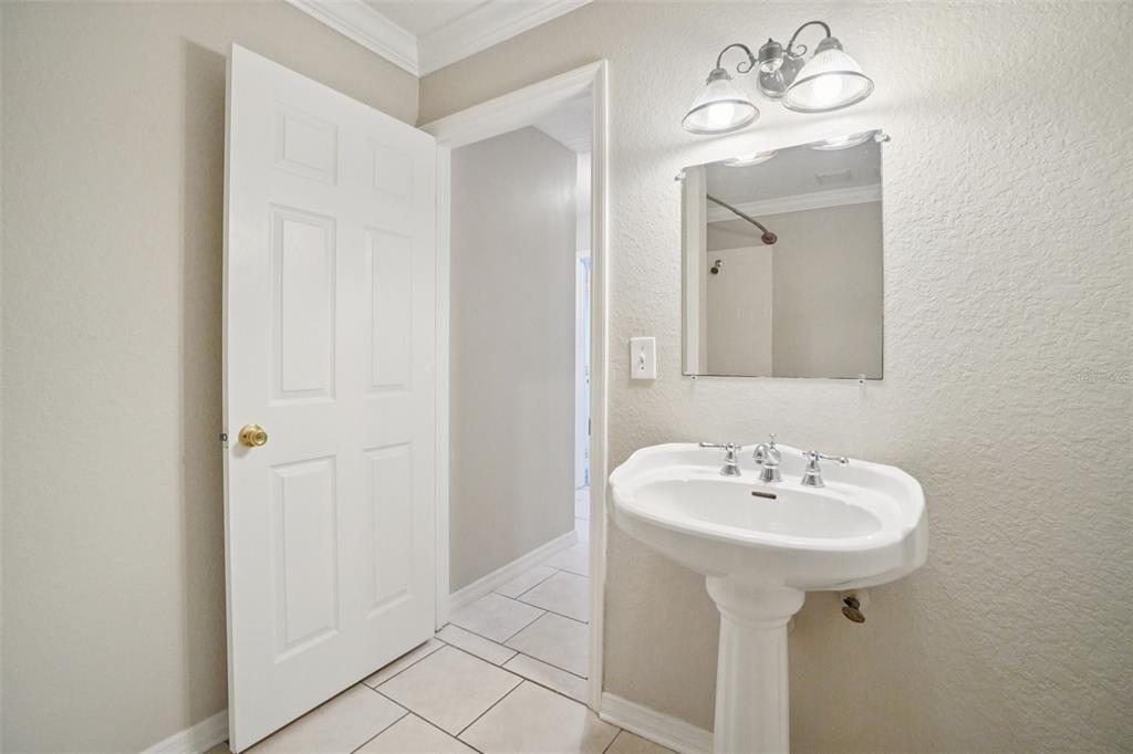 13210 Maple Street Odessa, FL 33556 - Photo 19 of 34 a bathroom with a sink and a mirror